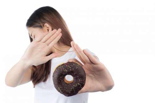 beautiful-asian-woman-with-happy-smile-holding-donut-hand