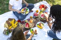 pvproductions-summer-picnic-with-friends-nature-with-food-drinks