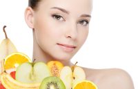 valuavitaly-young-female-face-with-fresh-fruits-isolated-white(1)